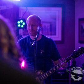 Rob playing guitar in Solarbird